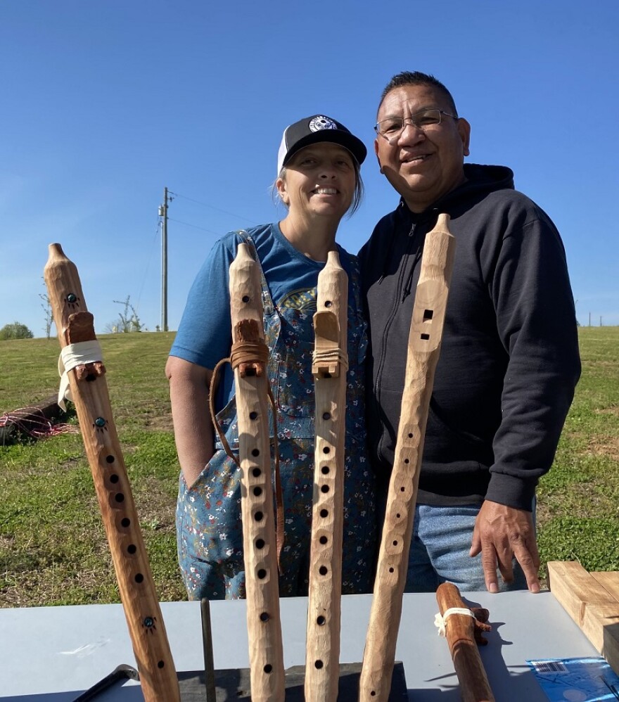 Fred and Angie Keams pose near several of Fred's Native American flutes. The couple is preparing for the Native Dawn Flute Gathering.