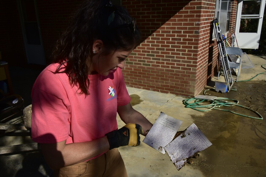 Tennessee locals band together to scrape out the mud left from Helene