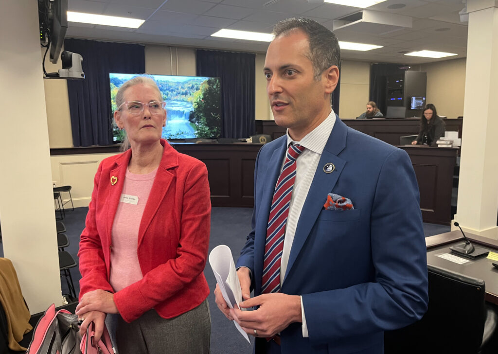 Rep. Daniel Grossberg, D-Louisville, right, speaks to reporters after a Legislative Ethics Commission meeting with his attorney, Anna Whites. (Kentucky Lantern photo by McKenna Horsley)