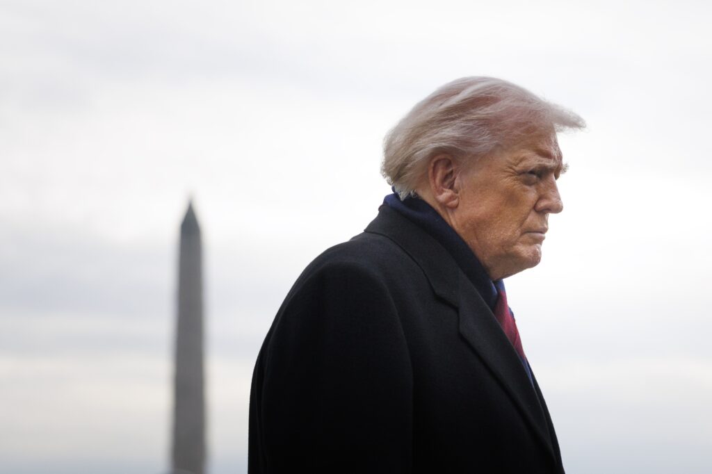 President Donald Trump speaks to reporters before boarding Marine One on the South Lawn of the White House in December 2025. (Photo by Tom Brenner/Getty Images)