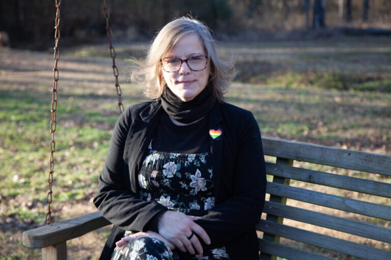 An outdoor portrait of a woman with shoulder