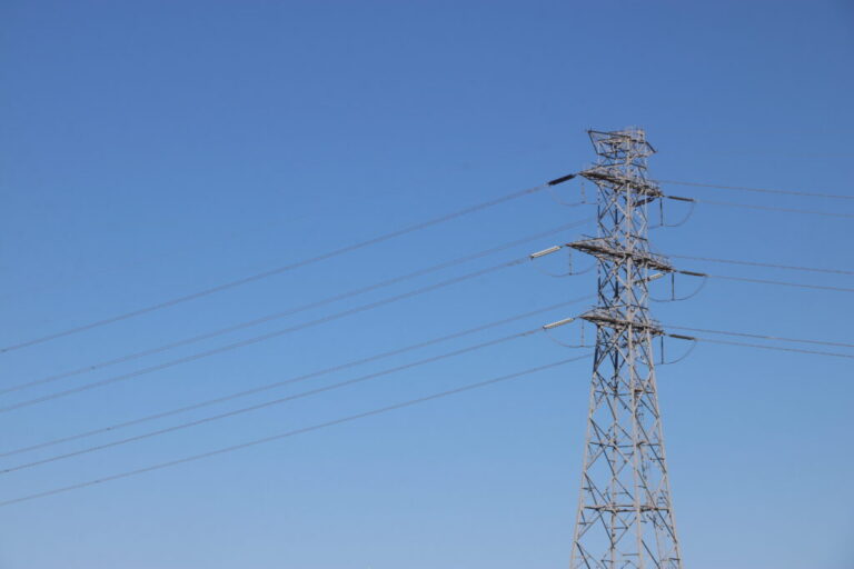 A tall metal transmission tower, or electricity