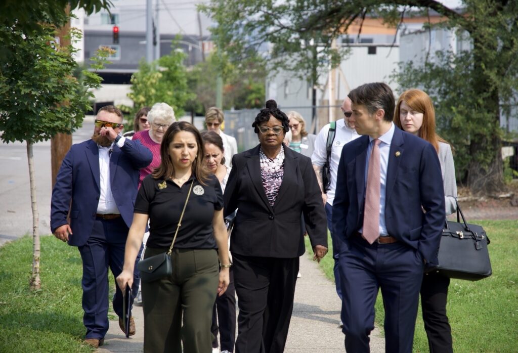 A diverse group of men and women dressed
