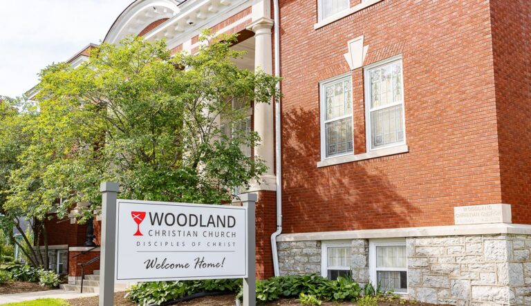 A white sign reading "Woodland Christian